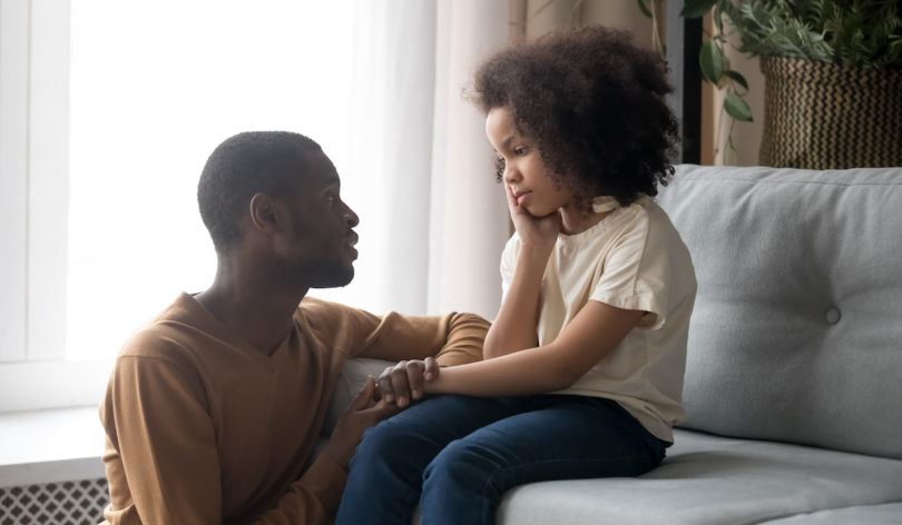 Father talking to his daughter about divorce in Colorado.