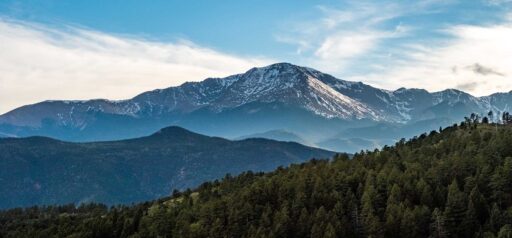 Image of Pikes Peak with wispy clouds and trees in foreground KHM Attorneys at Law Colorado Springs, Castle Rock