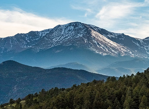 Image of Pikes Peak and green trees in foreground KHM Attorneys at Law Colorado Springs, Castle Rock