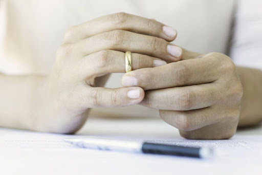 woman starts taking off wedding ring preparing for divorce KHM Attorneys at Law Colorado Springs, Castle Rock