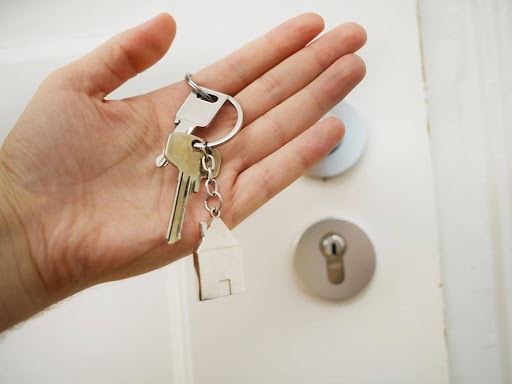 homeowner holds keys to new house after divorce KHM Attorneys at Law Colorado Springs, Castle Rock