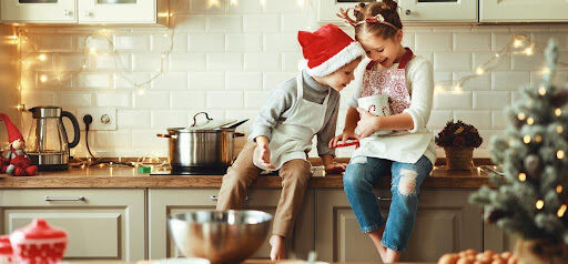 two children enjoy the holidays in the kitchen making treats KHM Attorneys at Law Colorado Springs, Castle Rock