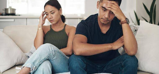 man and woman both with hands on their foreheads are struggling to communicate KHM Attorneys at Law Colorado Springs, Castle Rock