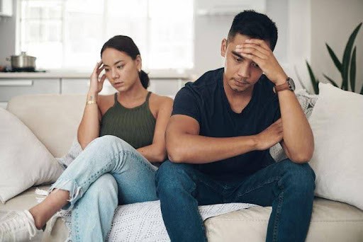 man and woman both with hands on their foreheads are struggling to communicate KHM Attorneys at Law Colorado Springs, Castle Rock