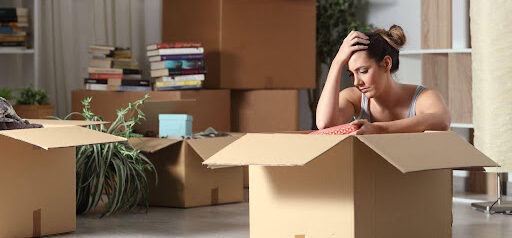 woman is stressed to pack because she did not get the house in the divorce KHM Attorneys at Law Colorado Springs, Castle Rock