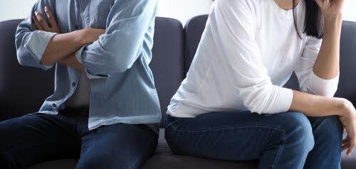 man and woman face away from each on couch not being to resolve differences KHM Attorneys at Law Colorado Springs, Castle Rock