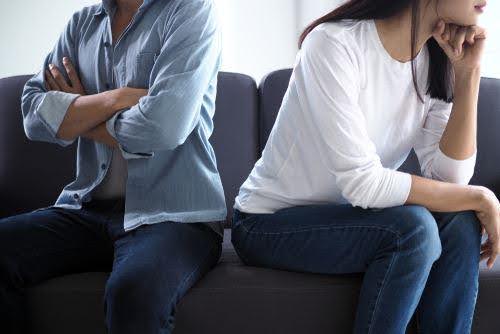 man and woman face away from each on couch not being to resolve differences KHM Attorneys at Law Colorado Springs, Castle Rock