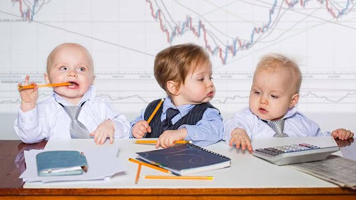 three toddlers pretending to prepare taxes KHM Attorneys at Law Colorado Springs, Castle Rock