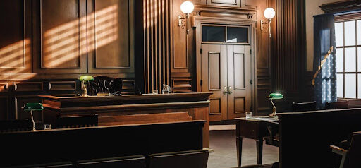 empty appeals courtroom with wood walls and furniture KHM Attorneys at Law Colorado Springs, Castle Rock