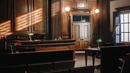 empty appeals courtroom with wood walls and furniture KHM Attorneys at Law Colorado Springs, Castle Rock
