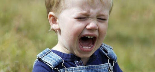 toddler in overalls crying KHM Attorneys at Law Colorado Springs, Castle Rock