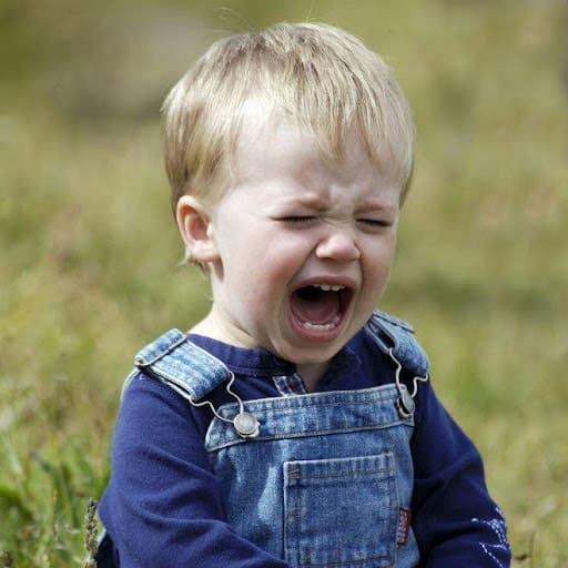 toddler in overalls crying KHM Attorneys at Law Colorado Springs, Castle Rock