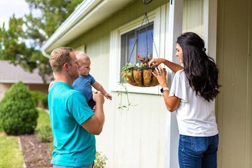 young man and woman are co-parenting their toddler while working in the backyard KHM Attorneys at Law Colorado Springs, Castle Rock