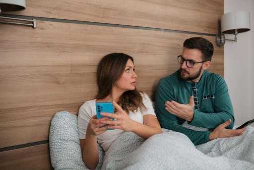 man and woman sitting in bedroom while in a disagreement KHM Attorneys at Law Colorado Springs, Castle Rock