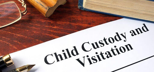 paper that says "child custody and visitation" with book in background KHM Attorneys at Law Colorado Springs, Castle Rock
