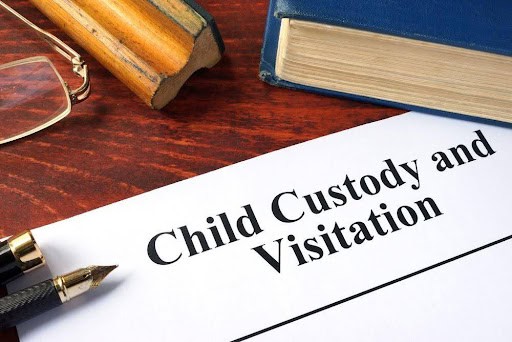 paper that says "child custody and visitation" with book in background KHM Attorneys at Law Colorado Springs, Castle Rock