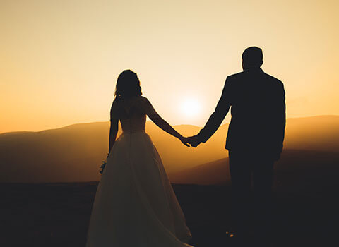 hero close up image of man and woman married at sunset KHM Attorneys at Law Colorado Springs, Castle Rock