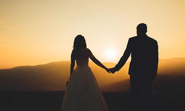 newlyweds enjoy sunset after marriage KHM Attorneys at Law Colorado Springs, Castle Rock