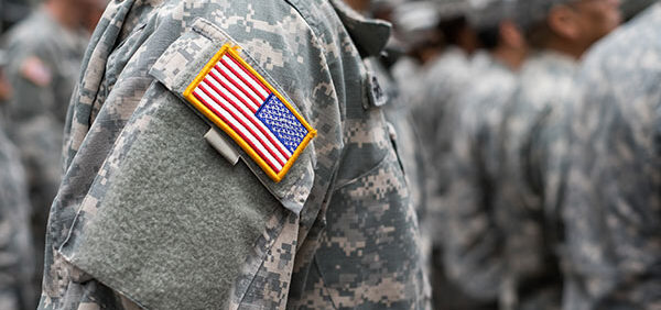 military employee wearing fatigues stands at attention KHM Attorneys at Law Colorado Springs, Castle Rock