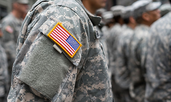 military employee wearing fatigues stands at attention KHM Attorneys at Law Colorado Springs, Castle Rock
