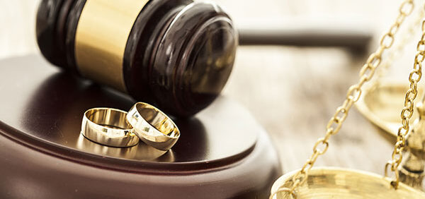 gavel, two wedding rings, and legal scale KHM Attorneys at Law Colorado Springs, Castle Rock